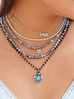Naszyjnik z niebieskim opalizującym żukiem i kryształkami Tina NMI0155