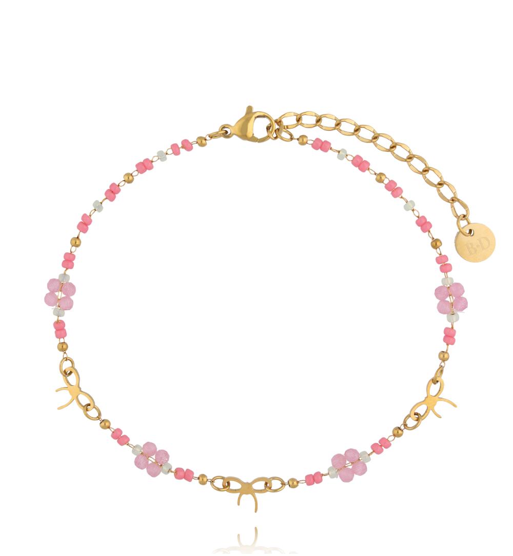 Bransoletka na nogę z różowymi koralikami i delikatnymi kokardkami BNSY0073