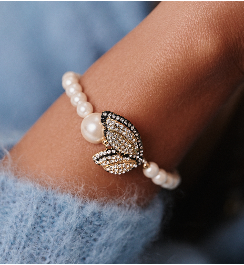 Bransoletka z perełkami i złoconymi skrzydłami z cyrkoniami BSS0231