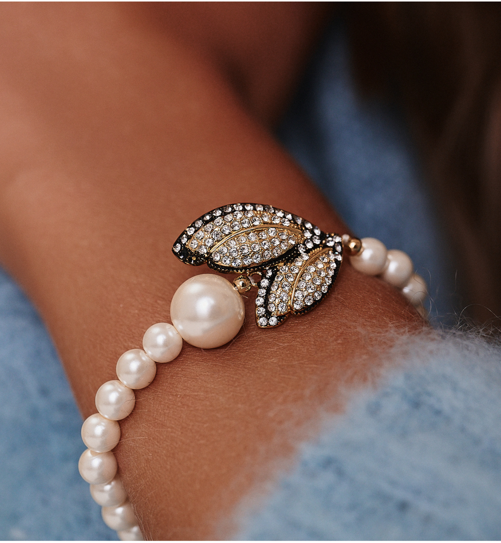 Bransoletka z perełkami i złoconymi skrzydłami z cyrkoniami BSS0231