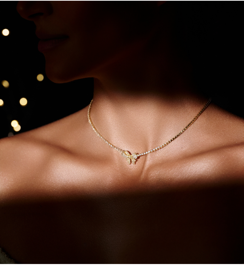 Naszyjnik typu tennis z zawieszką w kształcie kokardki NS0394