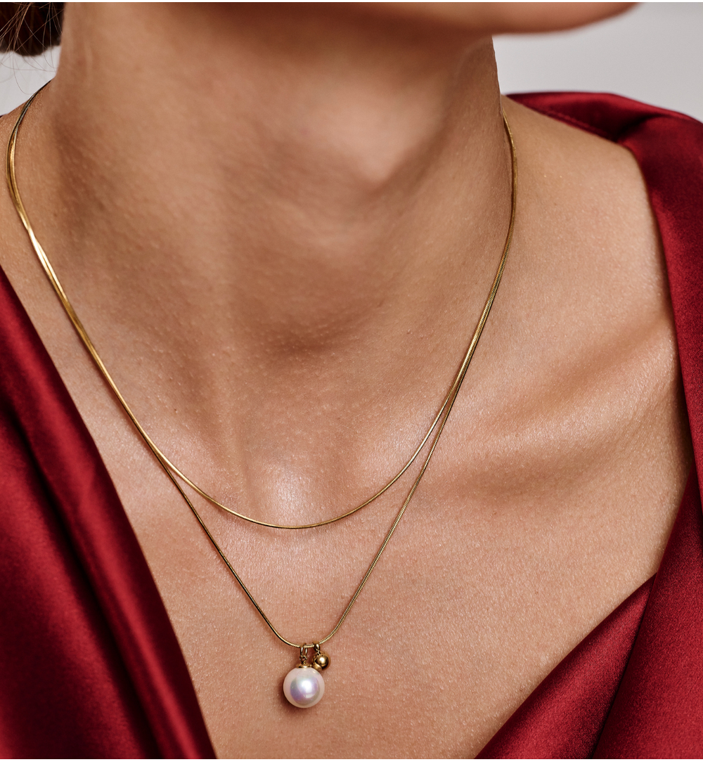 Naszyjnik podwójny ze stali szlachetnej złoconej z perłą NSY0699