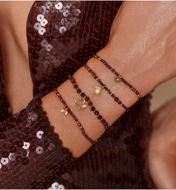 Bransoletka z naturalnego granatu i złoconą kokardką BTW3540