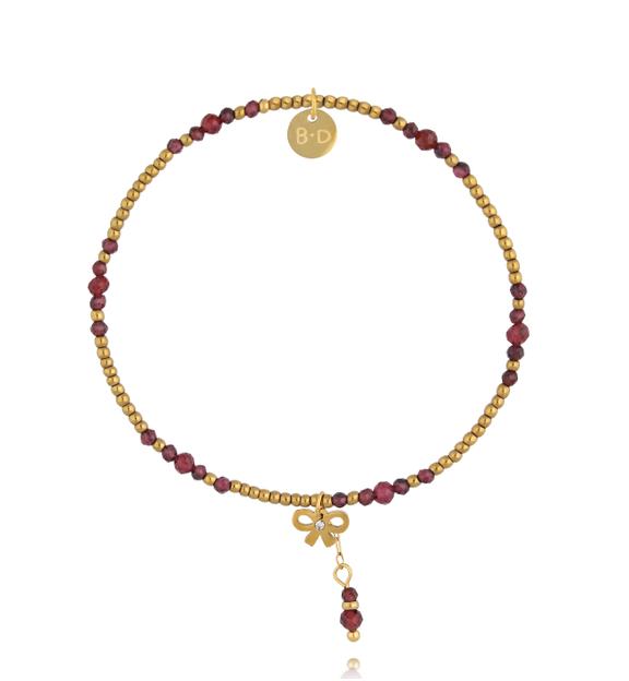 Bransoletka z granatu ze złotymi koralikami i zawieszką kokardki BTW3573